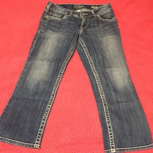 Silver brand,distressed light blue jeans.